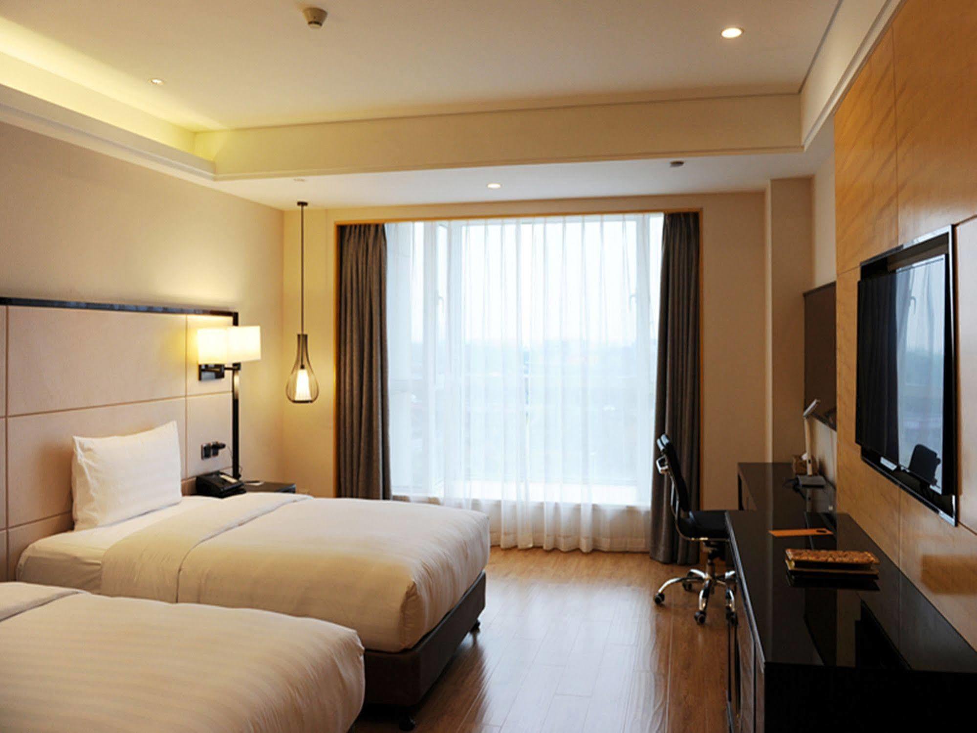Pullman Qingdao Ziyue Hotel Exterior foto